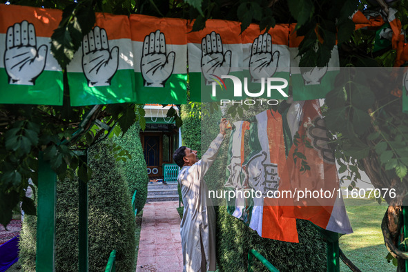 Indian National Congress workers install party flags ahead of Rahul Gandhi's visit to Sopore, Jammu and Kashmir, India, on September 25, 202...