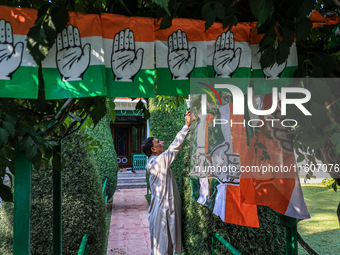 Indian National Congress workers install party flags ahead of Rahul Gandhi's visit to Sopore, Jammu and Kashmir, India, on September 25, 202...