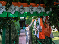 Indian National Congress workers install party flags ahead of Rahul Gandhi's visit to Sopore, Jammu and Kashmir, India, on September 25, 202...