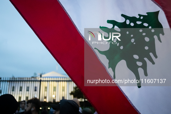 Protesters hold a demonstration in front of the White House in support of Lebanon following extensive air strikes by Israel, in Washington,...