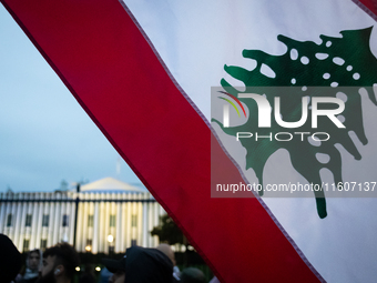 Protesters hold a demonstration in front of the White House in support of Lebanon following extensive air strikes by Israel, in Washington,...