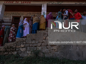 People wait to cast their votes in the second phase of Assembly elections in Beerwah, Jammu and Kashmir, India, on September 25, 2024 (