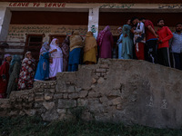 People wait to cast their votes in the second phase of Assembly elections in Beerwah, Jammu and Kashmir, India, on September 25, 2024 (