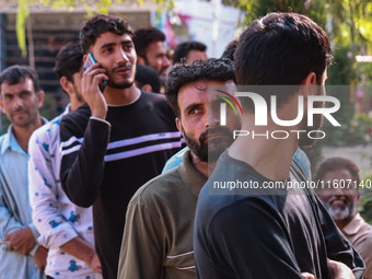 People wait to cast their votes in the second phase of Assembly elections in Beerwah, Jammu and Kashmir, India, on September 25, 2024 (