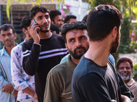 People wait to cast their votes in the second phase of Assembly elections in Beerwah, Jammu and Kashmir, India, on September 25, 2024 (