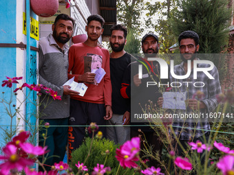 People wait to cast their votes in the second phase of Assembly elections in Beerwah, Jammu and Kashmir, India, on September 25, 2024 (