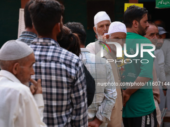 People wait to cast their votes in the second phase of Assembly elections in Beerwah, Jammu and Kashmir, India, on September 25, 2024 (