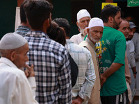 People wait to cast their votes in the second phase of Assembly elections in Beerwah, Jammu and Kashmir, India, on September 25, 2024 (