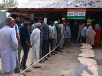 People wait to cast their votes in the second phase of Assembly elections in Beerwah, Jammu and Kashmir, India, on September 25, 2024 (