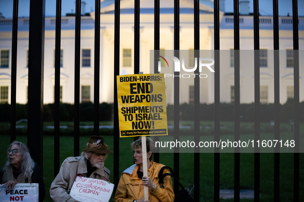 Protesters hold a demonstration in front of the White House in support of Lebanon following extensive air strikes by Israel, in Washington,...