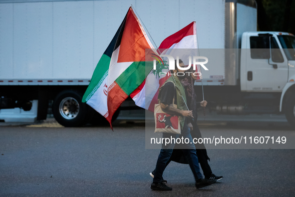 Protesters walk to a demonstration in front of the White House in support of Lebanon following extensive air strikes by Israel, in Washingto...