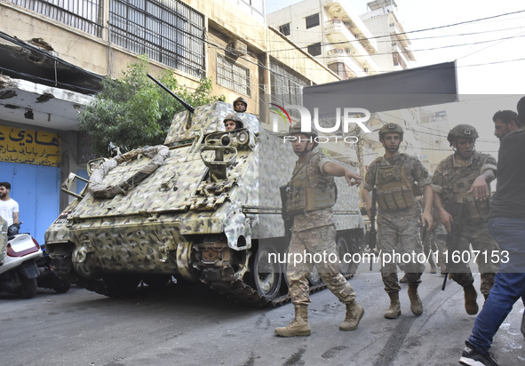 Lebanese security forces take security measures in the area after an Israeli airstrike in Beirut, Lebanon, on September 24, 2024. Six people...