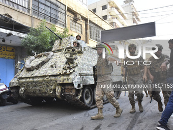 Lebanese security forces take security measures in the area after an Israeli airstrike in Beirut, Lebanon, on September 24, 2024. Six people...