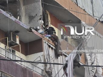 Lebanese security forces take security measures in the area after an Israeli airstrike in Beirut, Lebanon, on September 24, 2024. Six people...