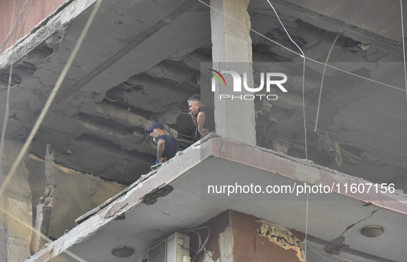 Lebanese security forces take security measures in the area after an Israeli airstrike in Beirut, Lebanon, on September 24, 2024. Six people...