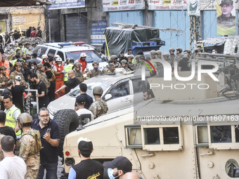 Lebanese security forces take security measures in the area after an Israeli airstrike in Beirut, Lebanon, on September 24, 2024. Six people...