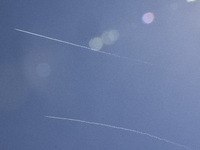 Israeli jet aircraft leave vapor trails while flying over Beirut, Lebanon, on September 24, 2024. Israel announces dozens of new air strikes...