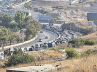 Lebanese people forced to flee their homes due to Israeli airstrikes migrate with what they can take with them to Saida, Lebanon, on Septemb...