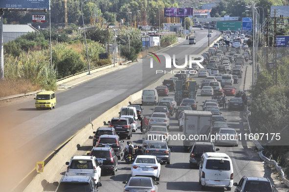 Lebanese people forced to flee their homes due to Israeli airstrikes migrate with what they can take with them to Saida, Lebanon, on Septemb...