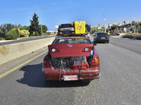 Lebanese people forced to flee their homes due to Israeli airstrikes migrate with what they can take with them to Saida, Lebanon, on Septemb...