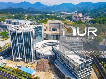 Workers step up construction at the project construction site of Big Data Industrial Park in Yuexi County, Anqing, China, on September 25, 2...