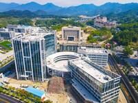 Workers step up construction at the project construction site of Big Data Industrial Park in Yuexi County, Anqing, China, on September 25, 2...