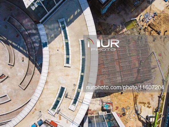 Workers step up construction at the project construction site of Big Data Industrial Park in Yuexi County, Anqing, China, on September 25, 2...