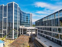 Workers step up construction at the project construction site of Big Data Industrial Park in Yuexi County, Anqing, China, on September 25, 2...