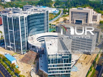 Workers step up construction at the project construction site of Big Data Industrial Park in Yuexi County, Anqing, China, on September 25, 2...