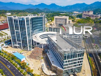 Workers step up construction at the project construction site of Big Data Industrial Park in Yuexi County, Anqing, China, on September 25, 2...