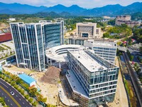 Workers step up construction at the project construction site of Big Data Industrial Park in Yuexi County, Anqing, China, on September 25, 2...