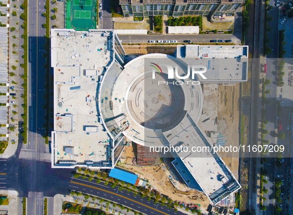 Workers step up construction at the project construction site of Big Data Industrial Park in Yuexi County, Anqing, China, on September 25, 2...