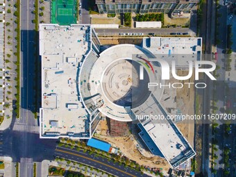 Workers step up construction at the project construction site of Big Data Industrial Park in Yuexi County, Anqing, China, on September 25, 2...