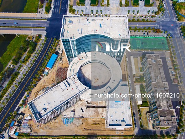 Workers step up construction at the project construction site of Big Data Industrial Park in Yuexi County, Anqing, China, on September 25, 2...