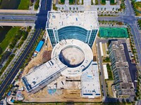 Workers step up construction at the project construction site of Big Data Industrial Park in Yuexi County, Anqing, China, on September 25, 2...