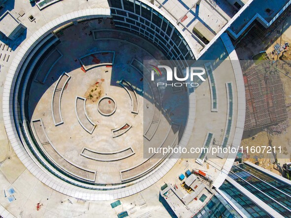 Workers step up construction at the project construction site of Big Data Industrial Park in Yuexi County, Anqing, China, on September 25, 2...