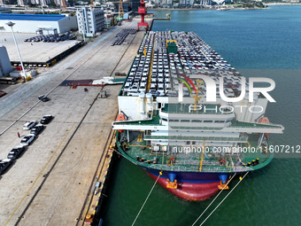 Roll-on wheels load export vehicles at the terminal of the Oriental Port Branch of Lianyungang Port in Lianyungang, China, on September 25,...