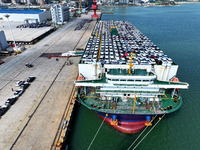 Roll-on wheels load export vehicles at the terminal of the Oriental Port Branch of Lianyungang Port in Lianyungang, China, on September 25,...