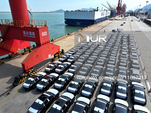 Roll-on wheels load export vehicles at the terminal of the Oriental Port Branch of Lianyungang Port in Lianyungang, China, on September 25,...