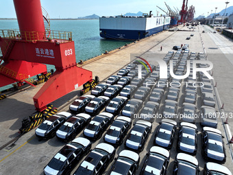 Roll-on wheels load export vehicles at the terminal of the Oriental Port Branch of Lianyungang Port in Lianyungang, China, on September 25,...