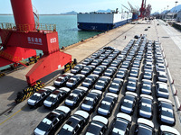 Roll-on wheels load export vehicles at the terminal of the Oriental Port Branch of Lianyungang Port in Lianyungang, China, on September 25,...