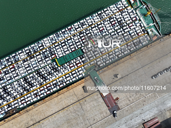 Roll-on wheels load export vehicles at the terminal of the Oriental Port Branch of Lianyungang Port in Lianyungang, China, on September 25,...