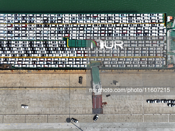 Roll-on wheels load export vehicles at the terminal of the Oriental Port Branch of Lianyungang Port in Lianyungang, China, on September 25,...