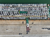 Roll-on wheels load export vehicles at the terminal of the Oriental Port Branch of Lianyungang Port in Lianyungang, China, on September 25,...