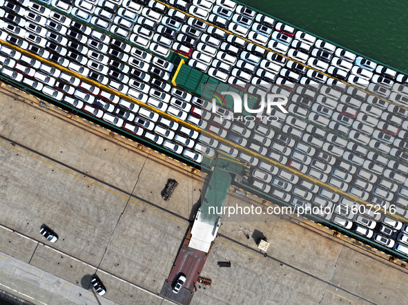 Roll-on wheels load export vehicles at the terminal of the Oriental Port Branch of Lianyungang Port in Lianyungang, China, on September 25,...