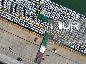 Roll-on wheels load export vehicles at the terminal of the Oriental Port Branch of Lianyungang Port in Lianyungang, China, on September 25,...