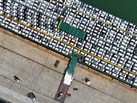 Roll-on wheels load export vehicles at the terminal of the Oriental Port Branch of Lianyungang Port in Lianyungang, China, on September 25,...