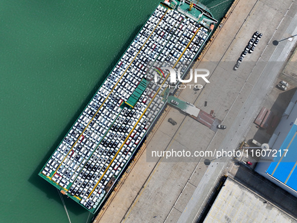 Roll-on wheels load export vehicles at the terminal of the Oriental Port Branch of Lianyungang Port in Lianyungang, China, on September 25,...