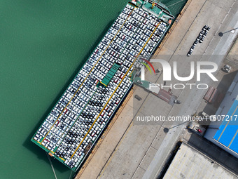 Roll-on wheels load export vehicles at the terminal of the Oriental Port Branch of Lianyungang Port in Lianyungang, China, on September 25,...