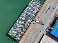 Roll-on wheels load export vehicles at the terminal of the Oriental Port Branch of Lianyungang Port in Lianyungang, China, on September 25,...